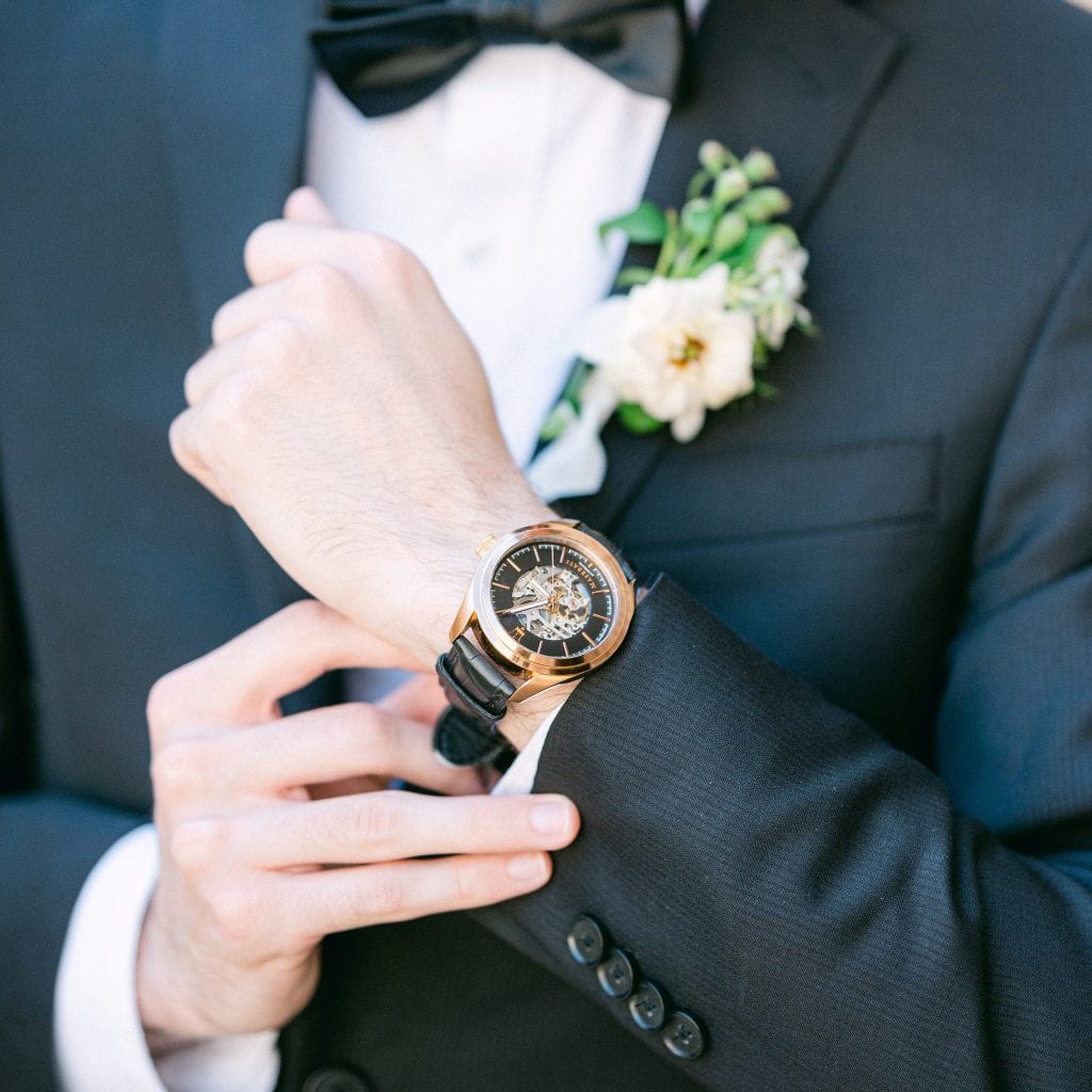 A groom showing off his beautiful family heirloom watch by Amy Huang Photography a Wedding Photographer in San Diego