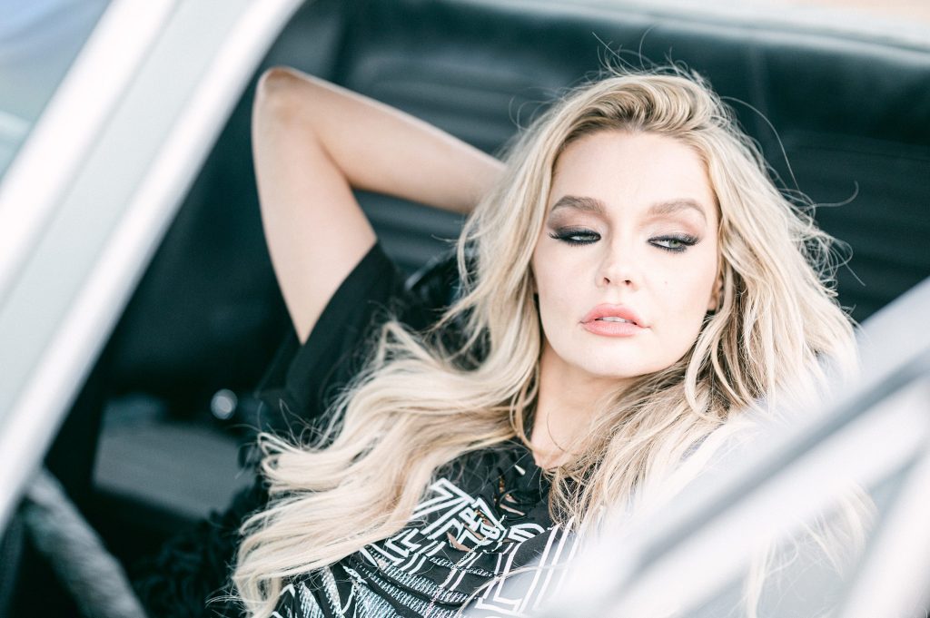 Beautiful model in an antique car looking outside the door, by Amy Huang Photography a San Diego Fashion Photogrpaher