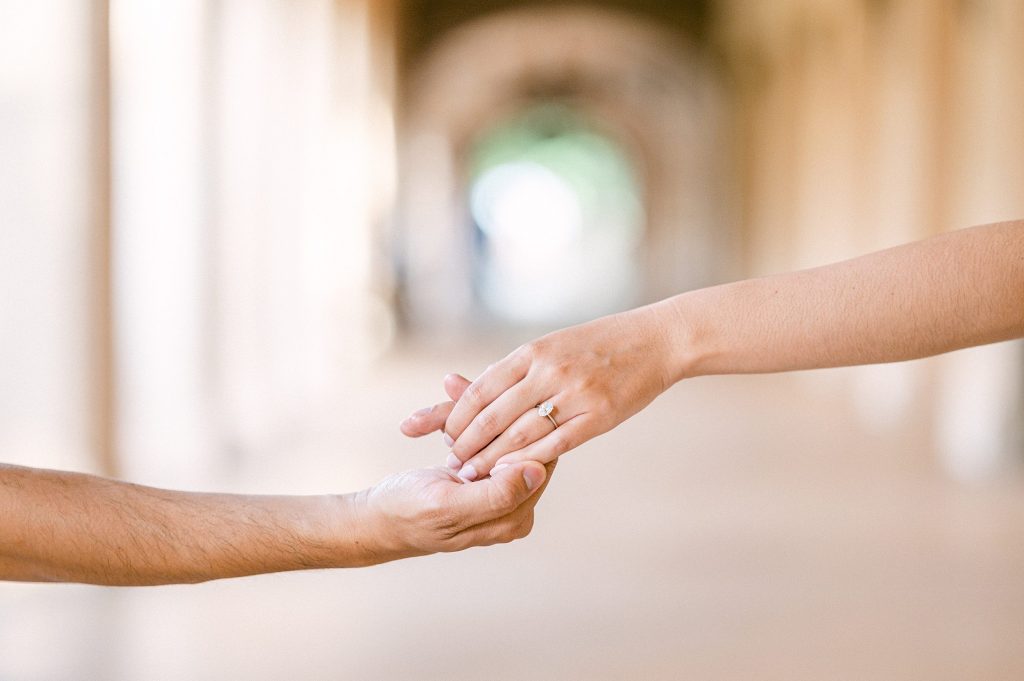 two hands holding together with ring showing by Amy Huang Photography a San Diego Wedding Photographer