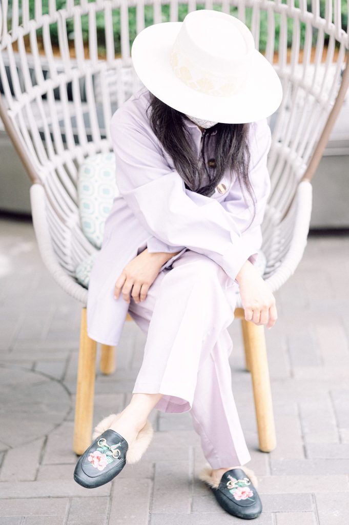 A San Diego wedding stylist dressed in a lavender suit and a hat, photo by Amy Huang Photography a San Diego Wedding Photographer