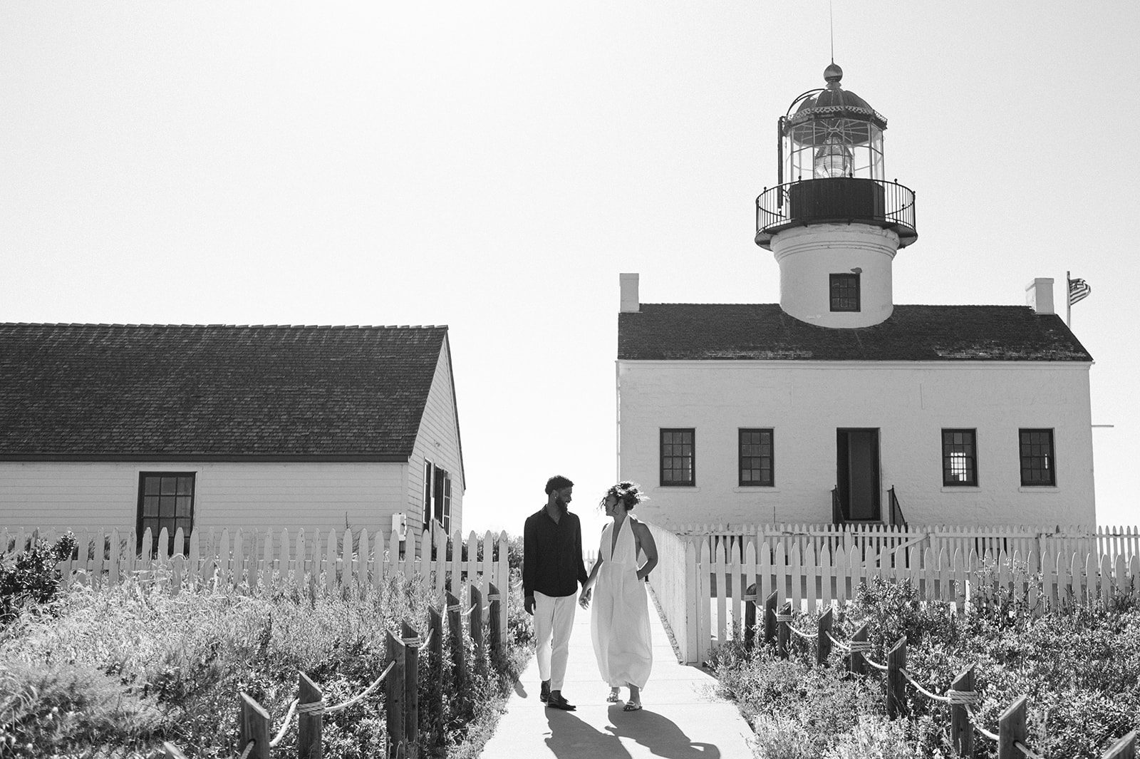Beautiful couple with a lighthouse in the backdrop edited by Refined Presets KT Merry